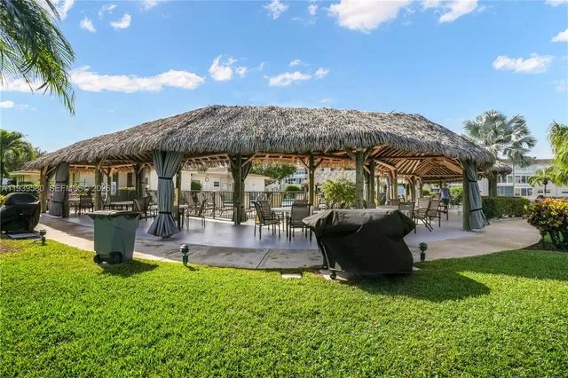 a dining room with furniture water view and balcony