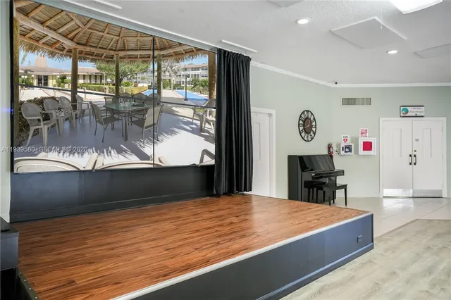 a view of a dining room with furniture wooden floor and chandelier