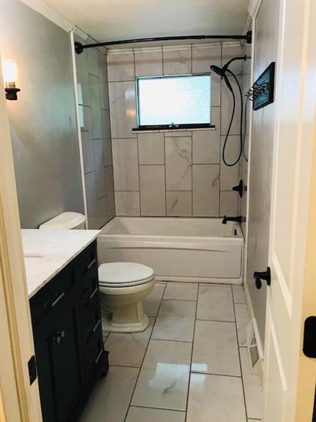 414 Garfield Road Latrobe, PA 15650 - Photo 12 of 24 Main Bathroom with jet tub and ceramic tile floors and tub surround