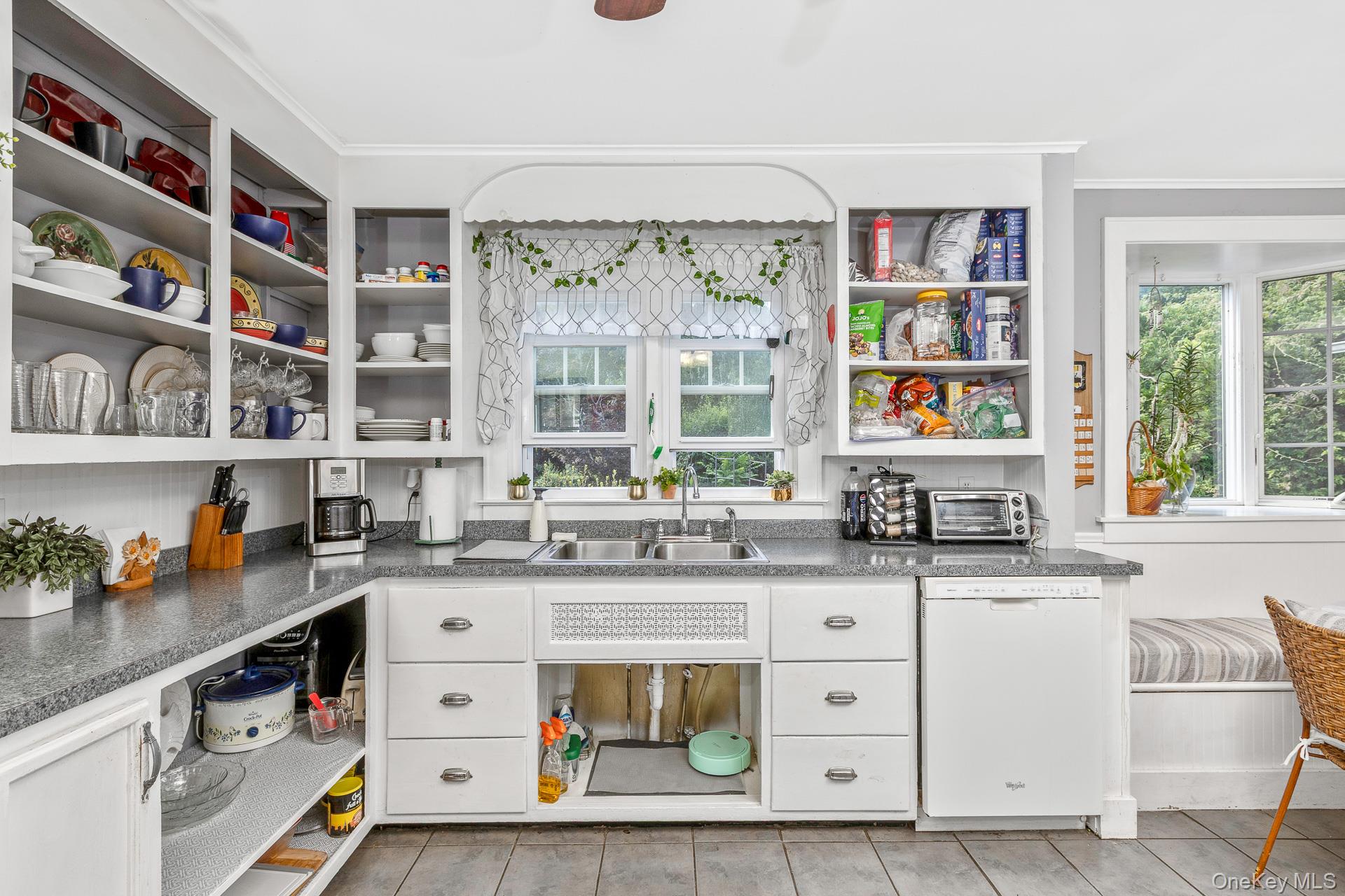 5660 Sound Avenue Mattituck, NY 11952 - Photo 15 of 43 Kitchen featuring open shelves, dishwasher, white cabinetry, dark countertops, and ornamental molding