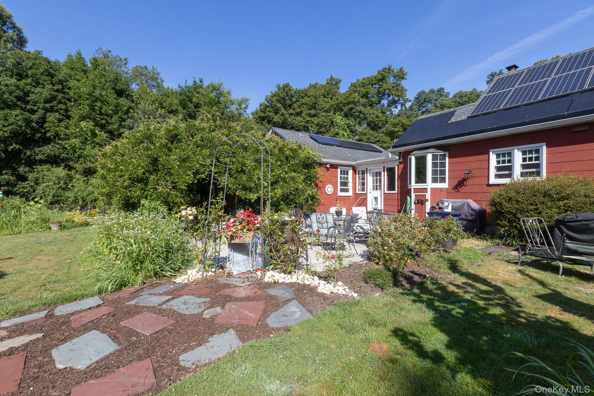 5660 Sound Avenue Mattituck, NY 11952 - Photo 31 of 43 View of grassy yard featuring a patio