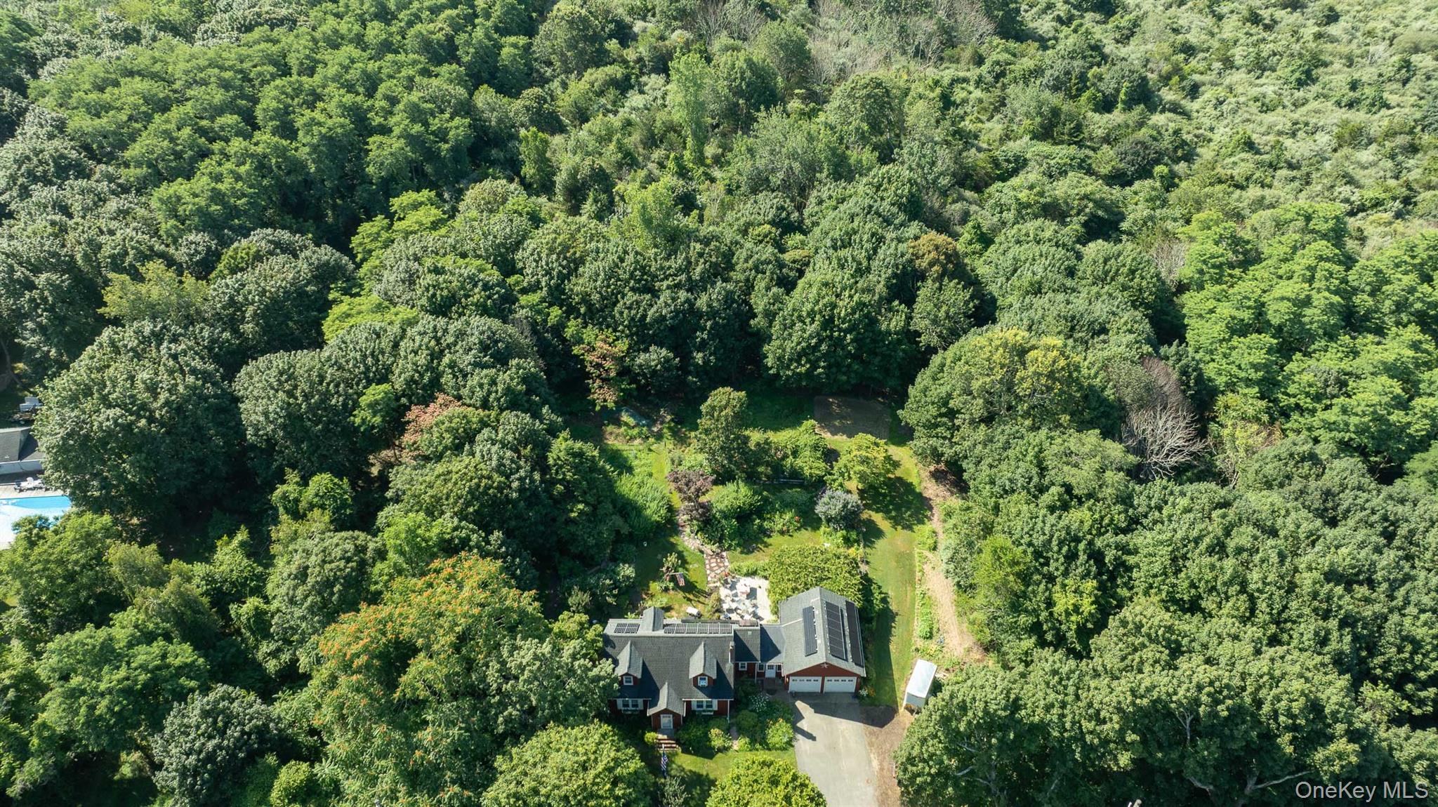 5660 Sound Avenue Mattituck, NY 11952 - Photo 37 of 43 View of property location with a heavily wooded area