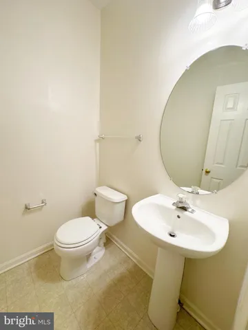 a view of empty room with a fireplace