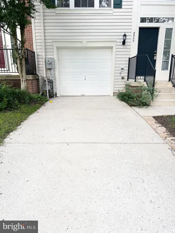 a front view of a house with garage