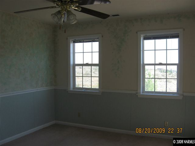 14150 Raider Run Road Reno, NV 89511 - Photo 9 of 9 an empty room with a window