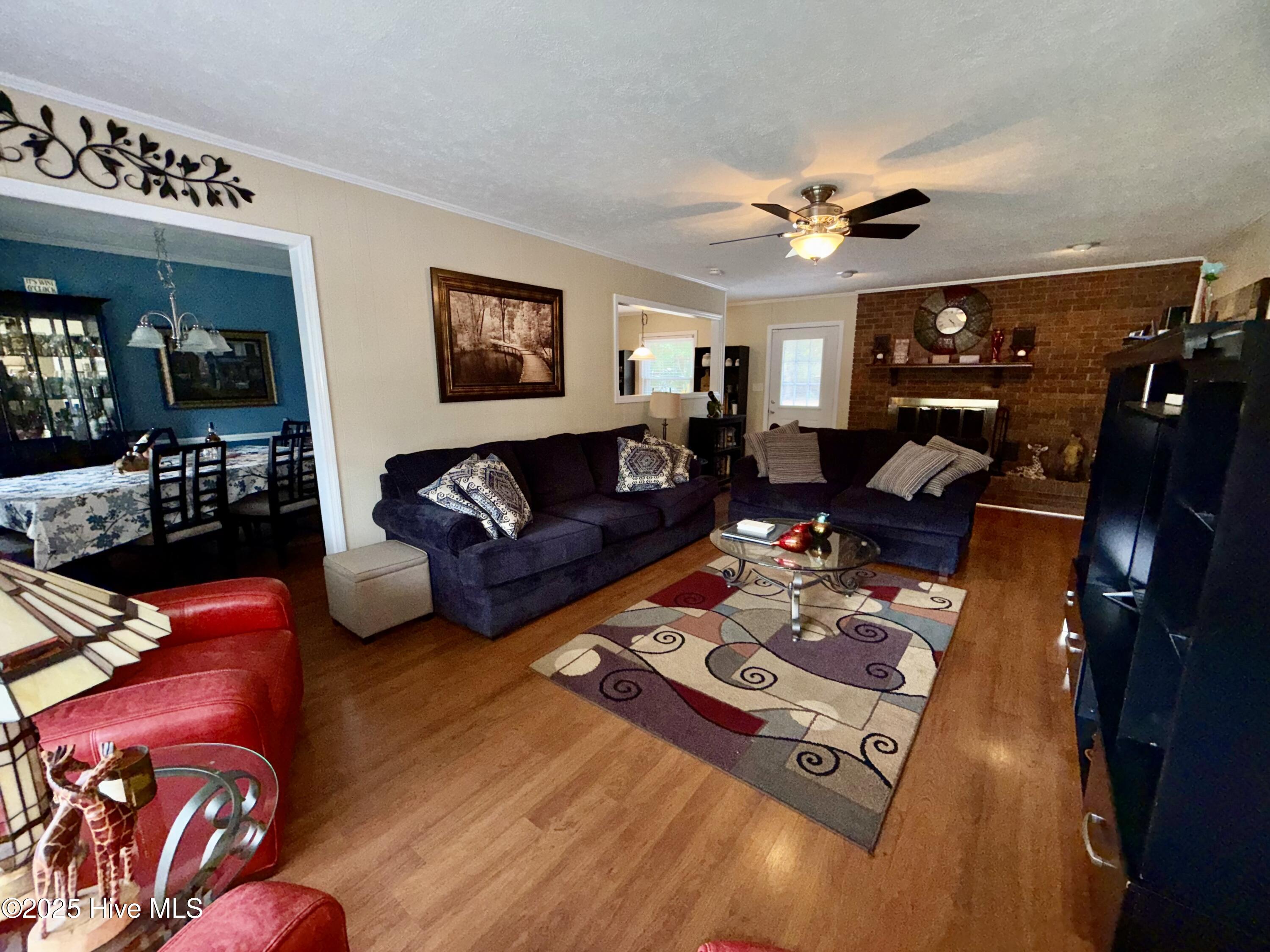 11561 Purcell Road Laurinburg, NC 28352 - Photo 5 of 36 Large family room with wood burning fireplace
