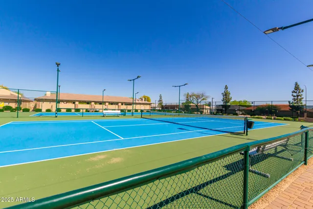 a view of an outdoor space and tennis court
