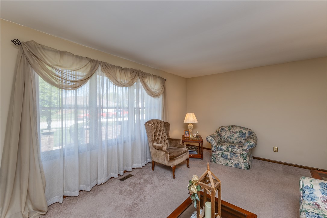 4210 Pleasanton Road Englewood, OH 45322 - Photo 6 of 34 This inviting living area features a broad window, filling the room with abundant natural light.