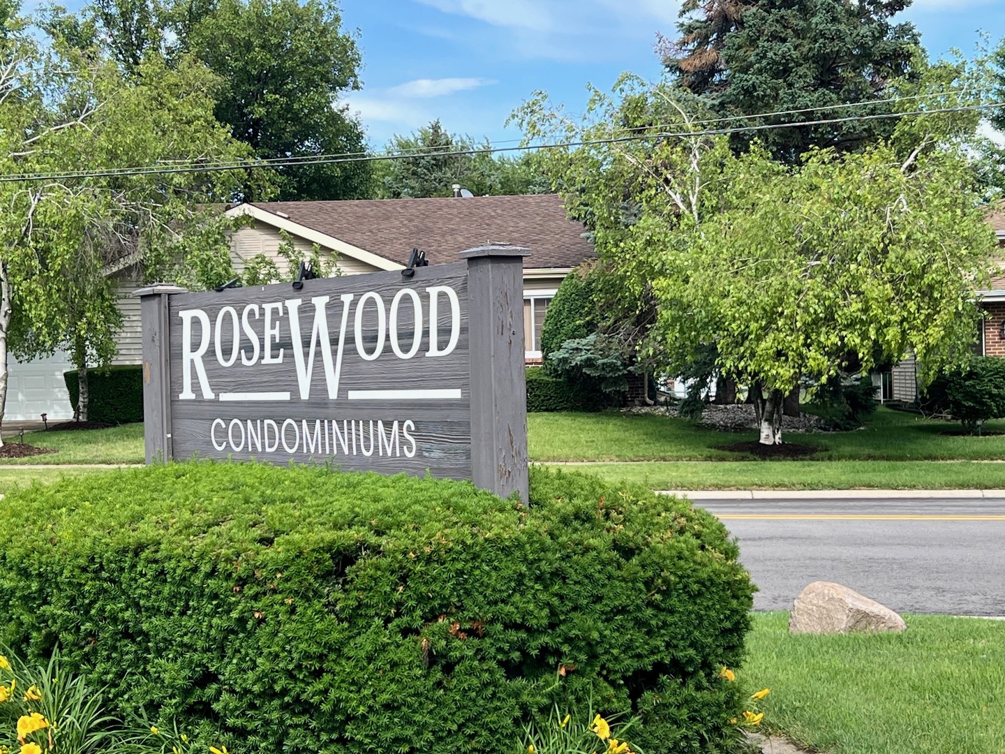 2219 Nichols Road, Unit 17A Arlington Heights, IL 60004 - Photo 2 of 19 a view of a street sign of a house on a park