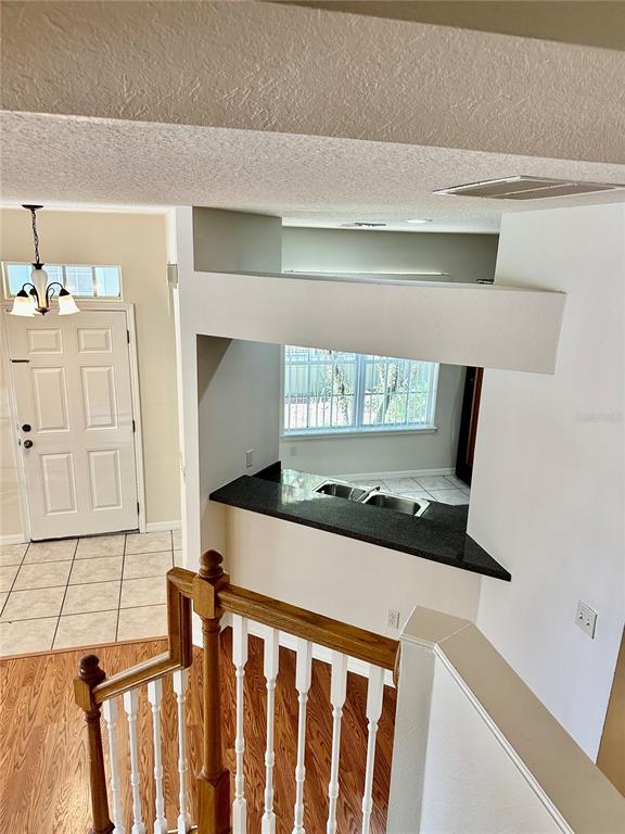 27747 Pleasure Ride Loop Wesley Chapel, FL 33544 - Photo 25 of 56 a kitchen with a cabinets and window