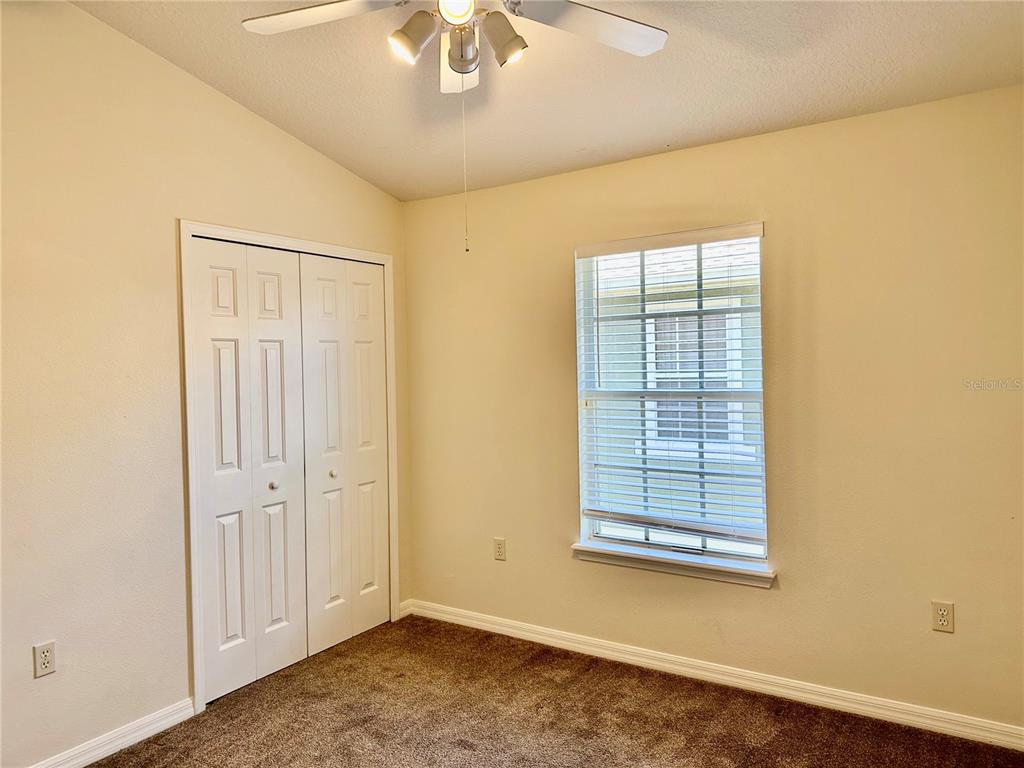 27747 Pleasure Ride Loop Wesley Chapel, FL 33544 - Photo 36 of 56 an empty room with a window