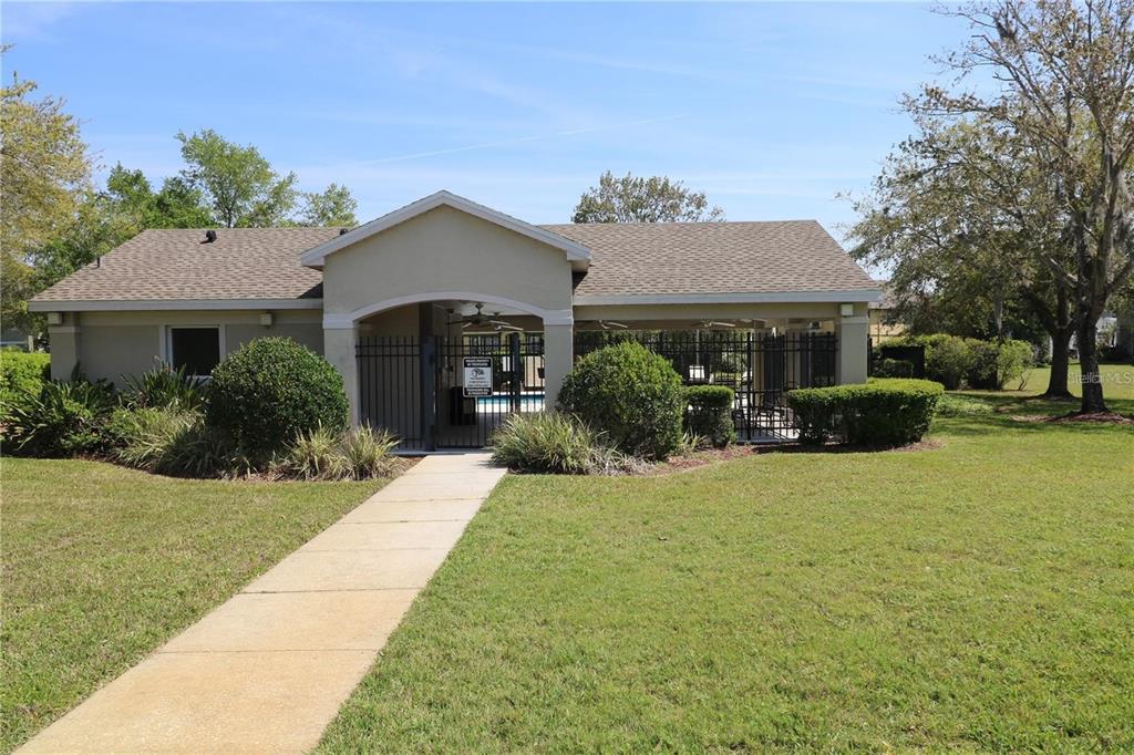 27747 Pleasure Ride Loop Wesley Chapel, FL 33544 - Photo 48 of 56 a front view of a house with garden