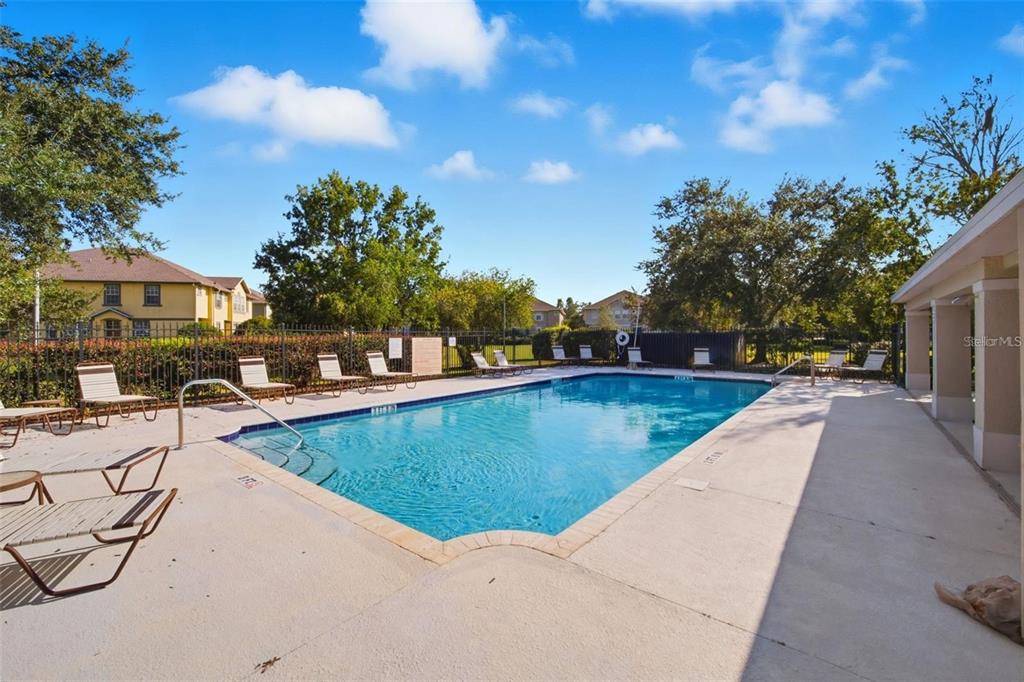 27747 Pleasure Ride Loop Wesley Chapel, FL 33544 - Photo 51 of 56 a view of swimming pool with outdoor seating and plants