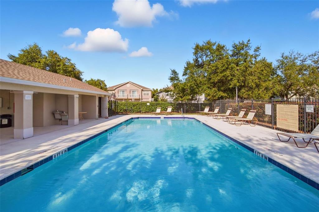 27747 Pleasure Ride Loop Wesley Chapel, FL 33544 - Photo 53 of 56 a swimming pool view with a outdoor space