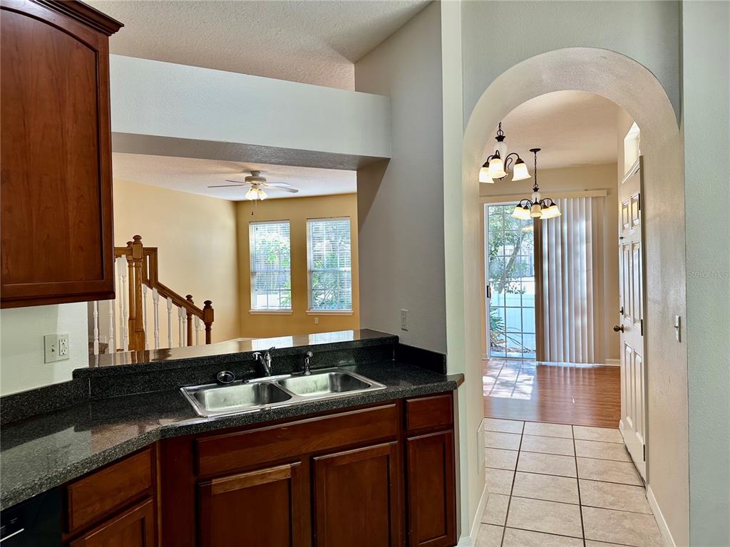 27747 Pleasure Ride Loop Wesley Chapel, FL 33544 - Photo 8 of 56 a kitchen with a sink and cabinets