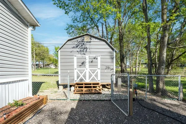 a house view with a sitting space garden view with a outdoor space