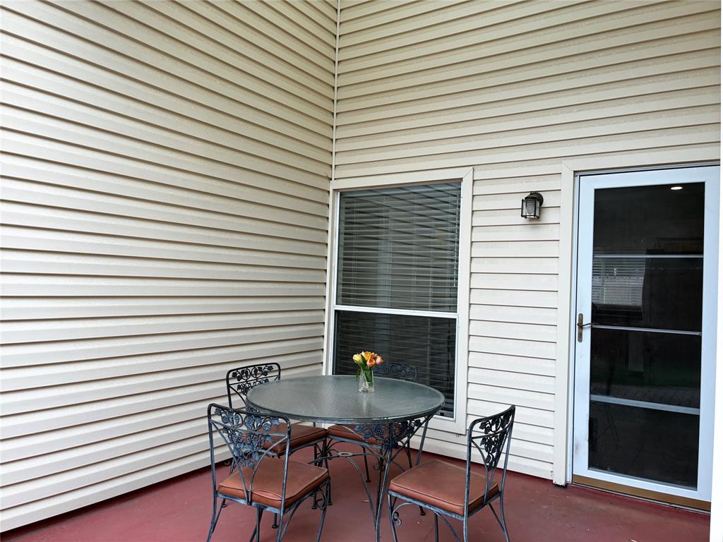 7936 Tournament Road Frisco, TX 75035 - Photo 23 of 28 a backyard of a house with table and chairs