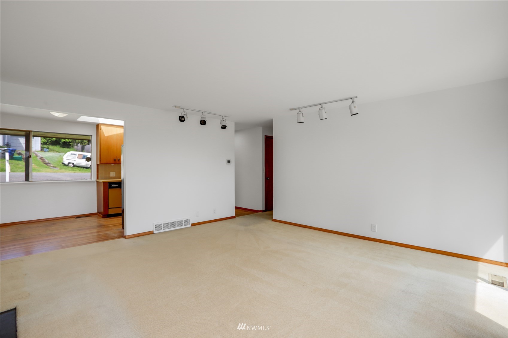 454 Lind Avenue Northwest Renton, WA 98057 - Photo 11 of 35 an empty room with windows