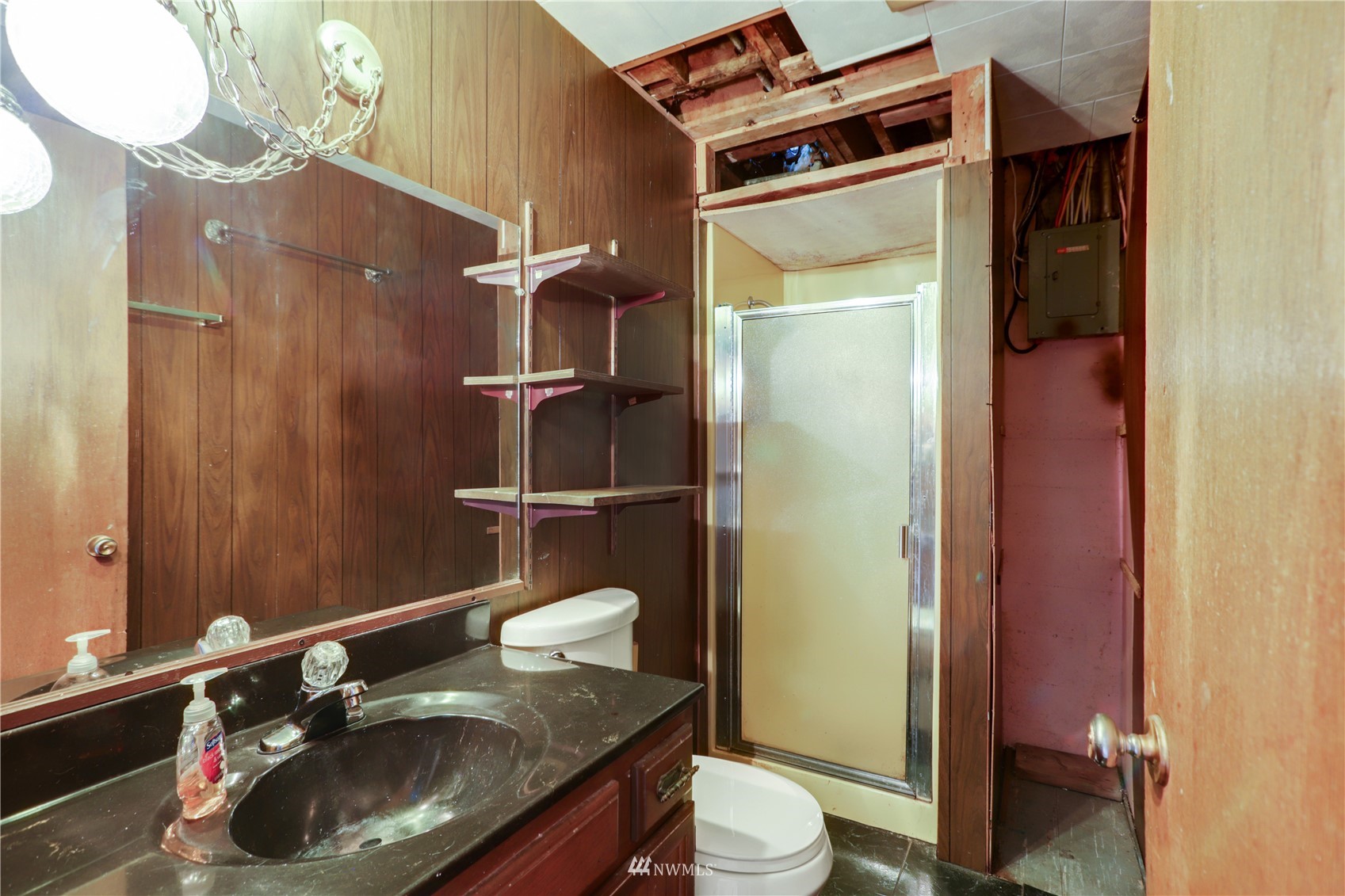 454 Lind Avenue Northwest Renton, WA 98057 - Photo 29 of 35 a bathroom with a sink and a mirror