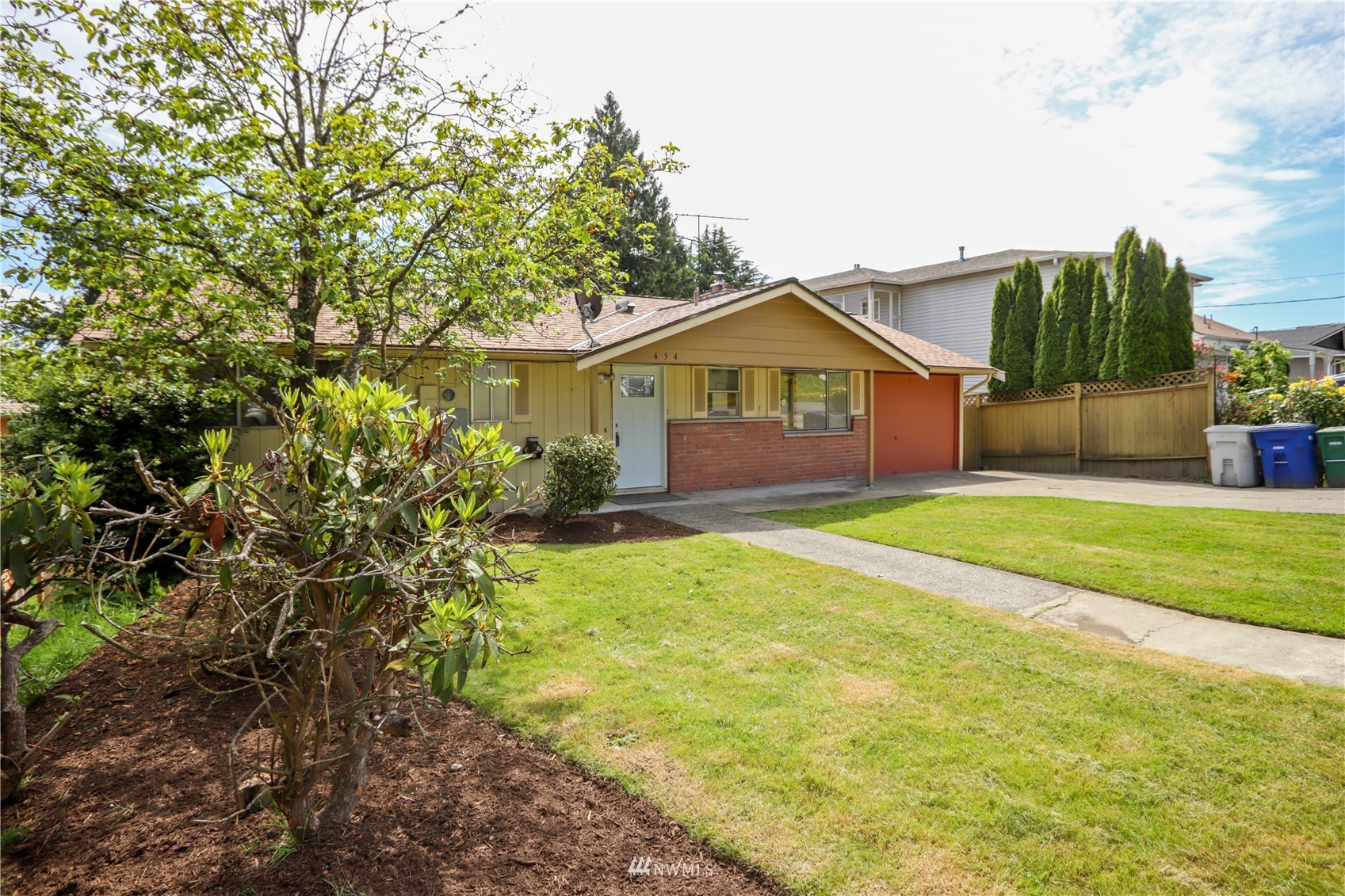 454 Lind Avenue Northwest Renton, WA 98057 - Photo 3 of 35 a view of a house with a yard and potted plants