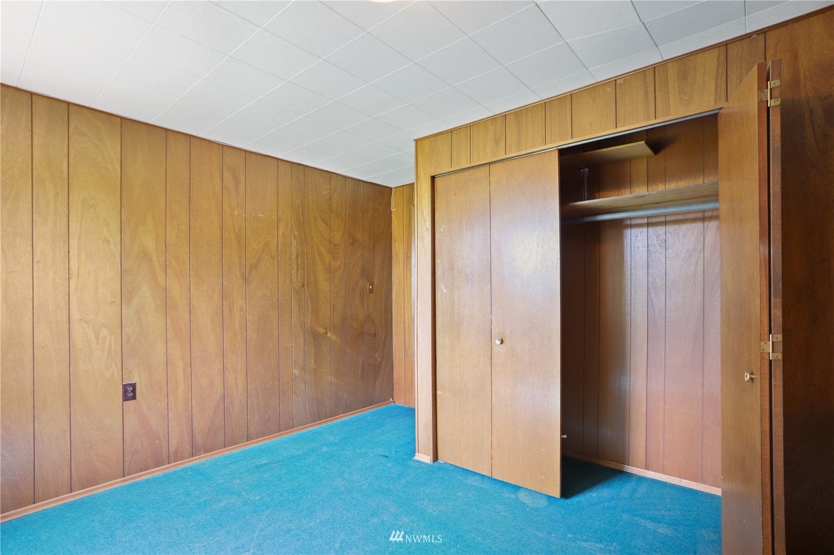 454 Lind Avenue Northwest Renton, WA 98057 - Photo 32 of 35 a view of an empty room with wooden floor and closet