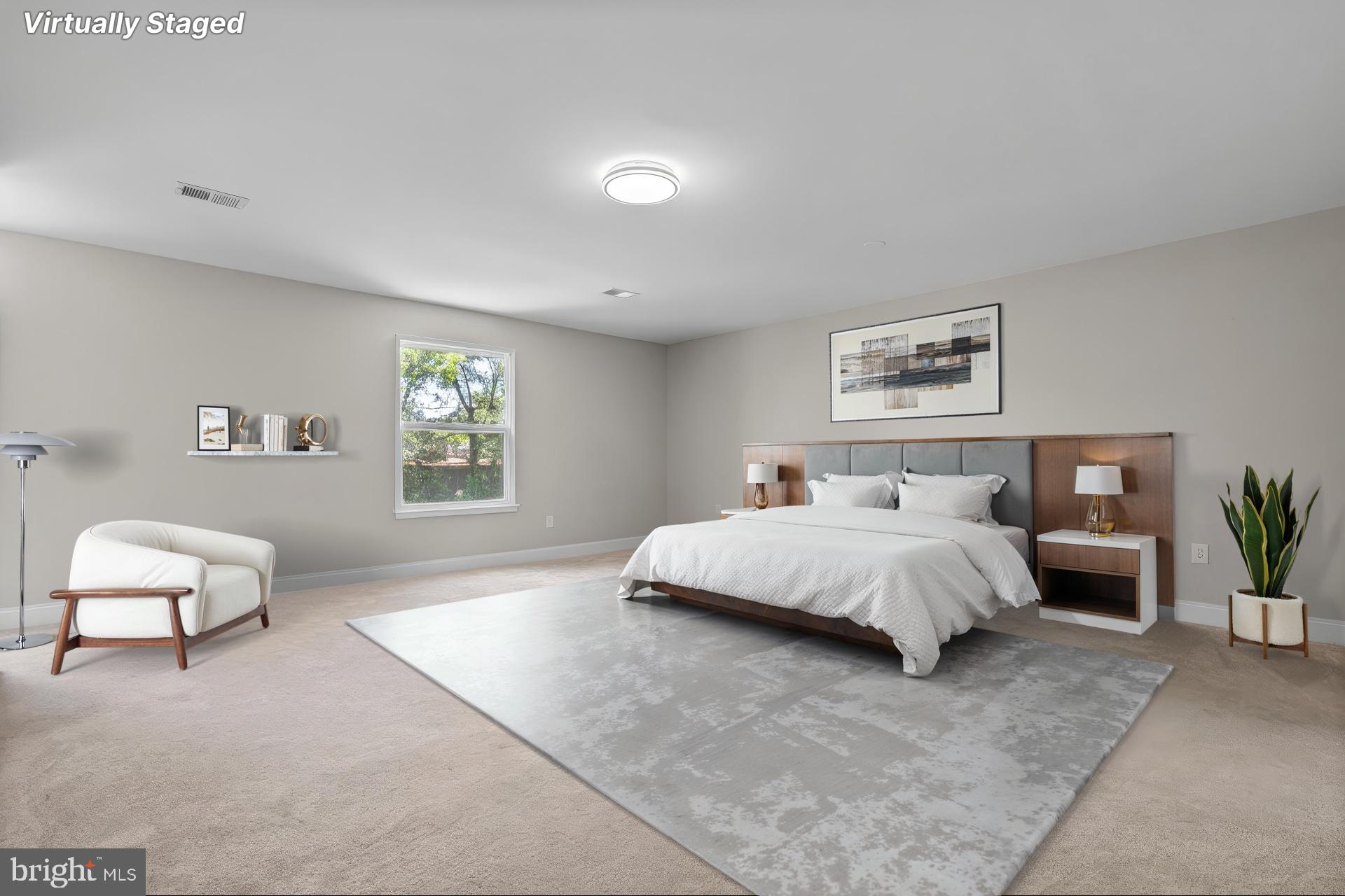 1501 Pine Grove Road Capitol Heights, MD 20743 - Photo 16 of 44 a spacious bedroom with a bed and a couch