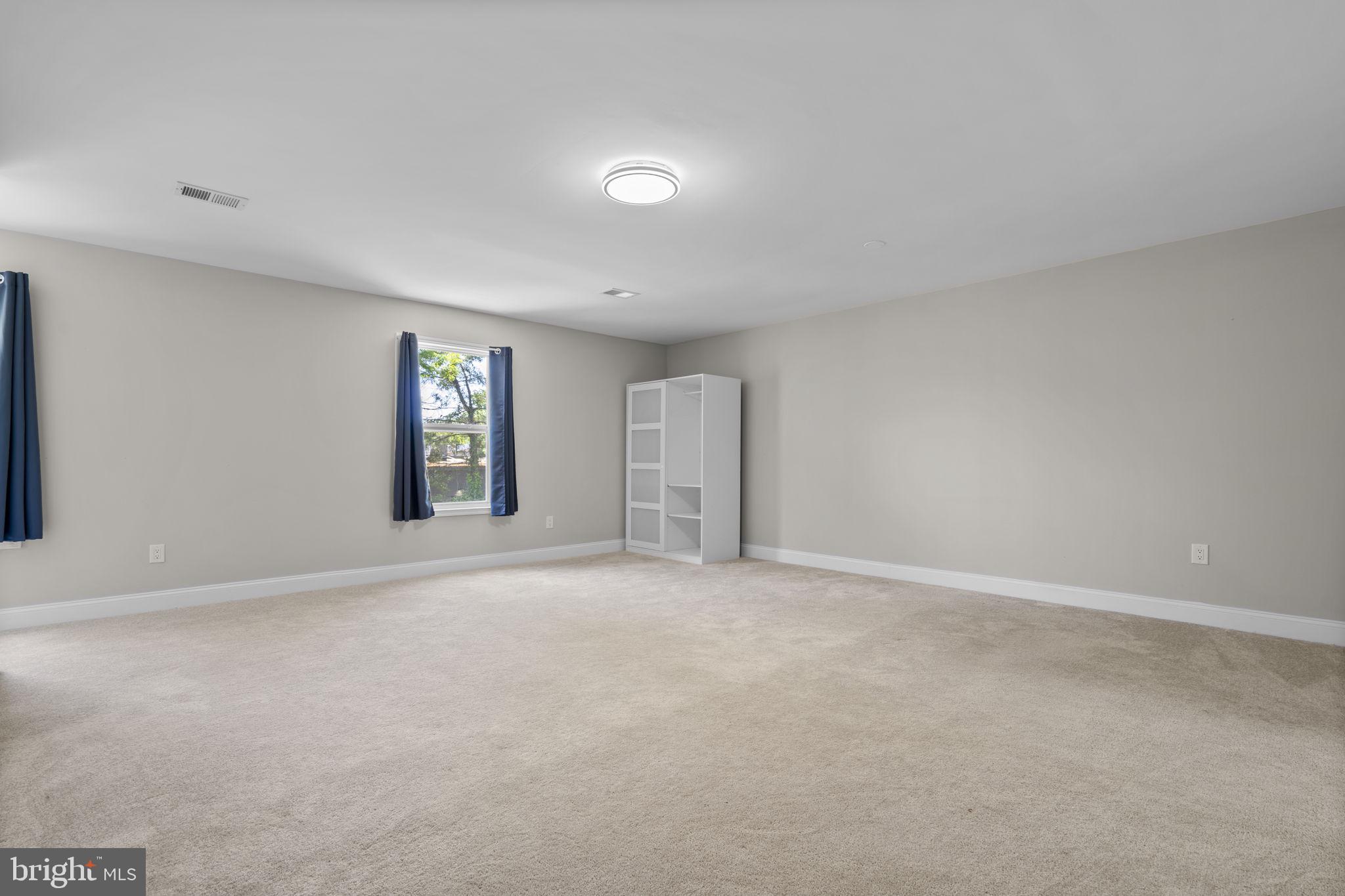 1501 Pine Grove Road Capitol Heights, MD 20743 - Photo 17 of 44 an empty room with windows