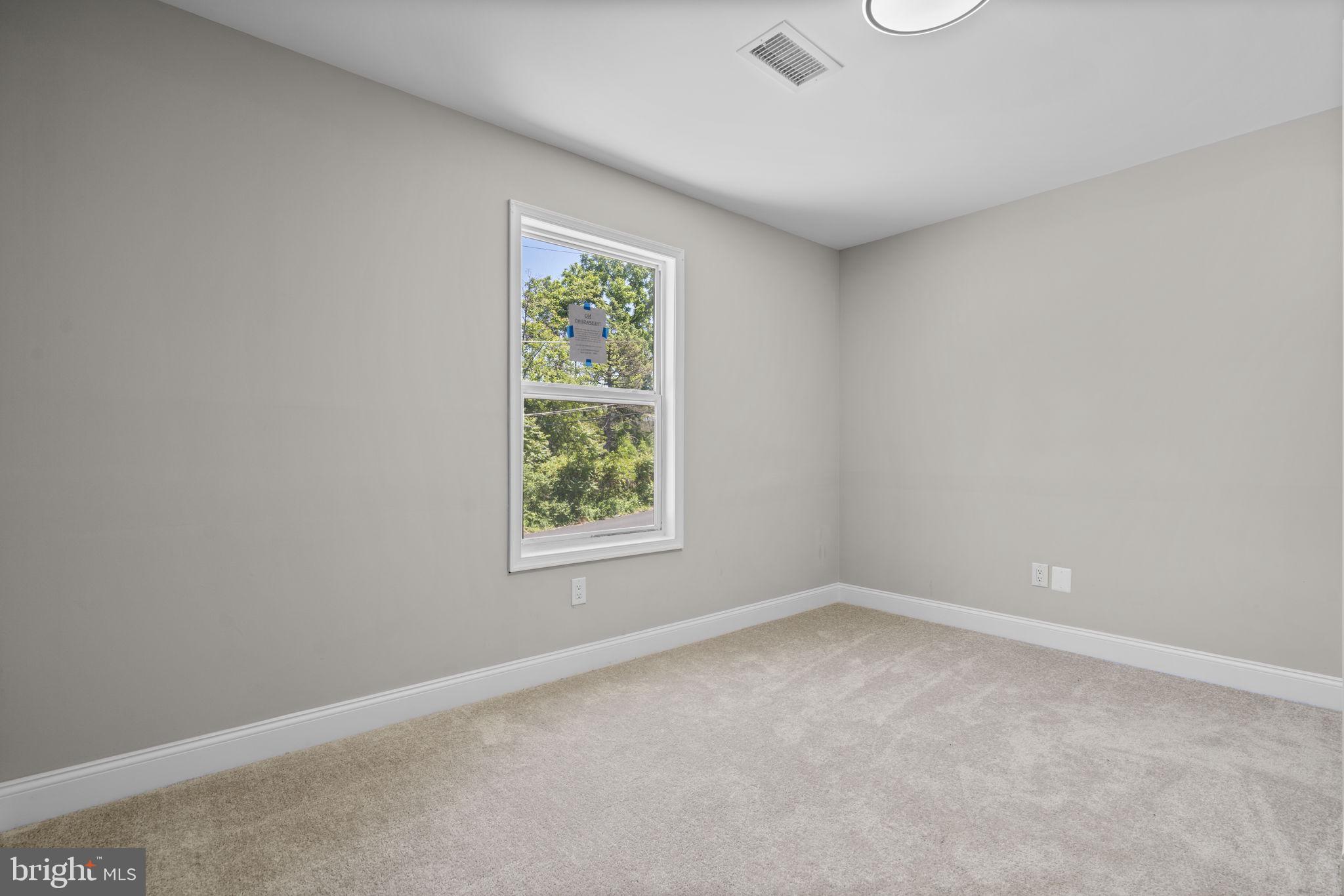 1501 Pine Grove Road Capitol Heights, MD 20743 - Photo 23 of 44 an empty room with windows