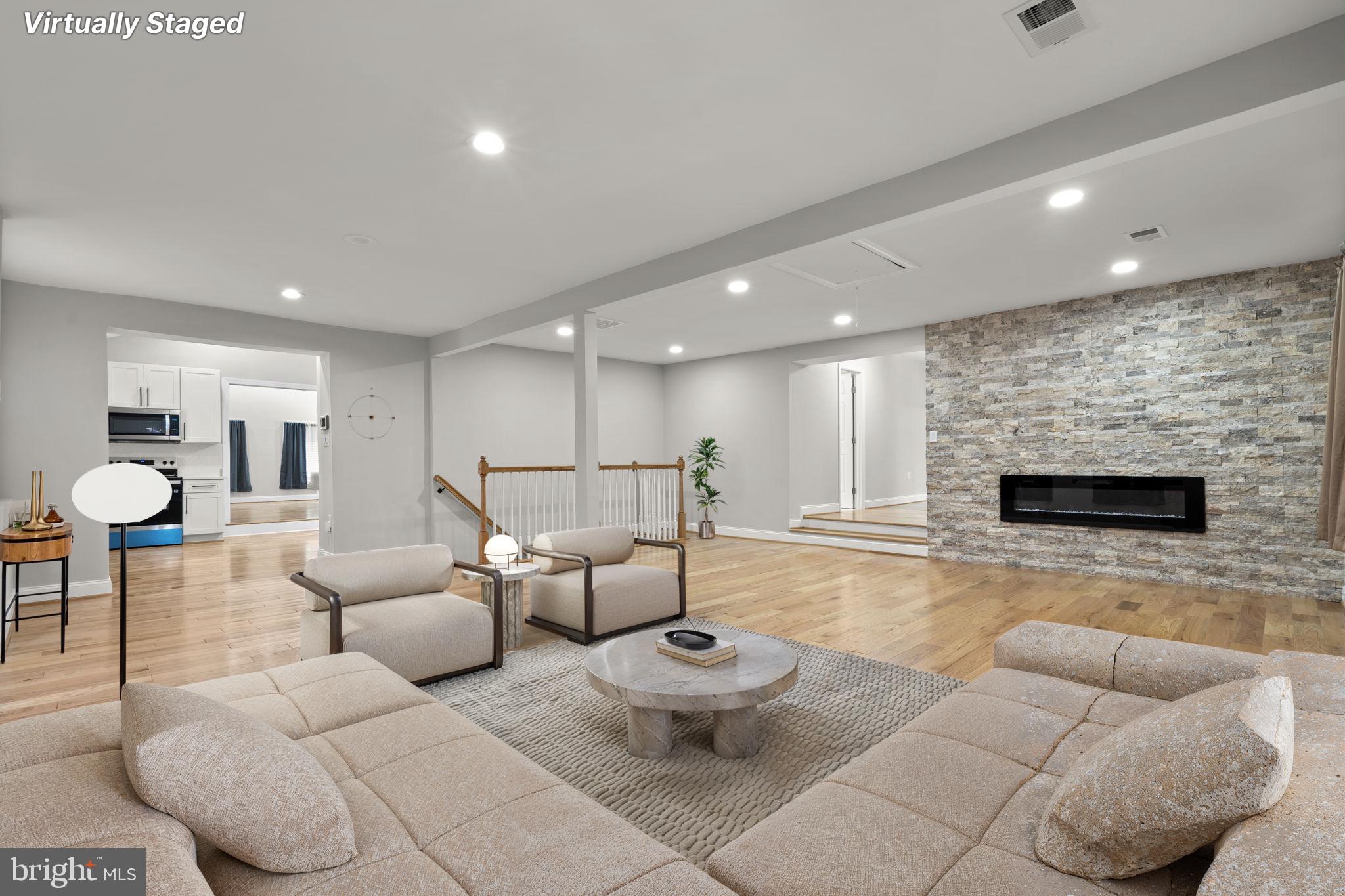 1501 Pine Grove Road Capitol Heights, MD 20743 - Photo 3 of 44 a living room with furniture and a fireplace