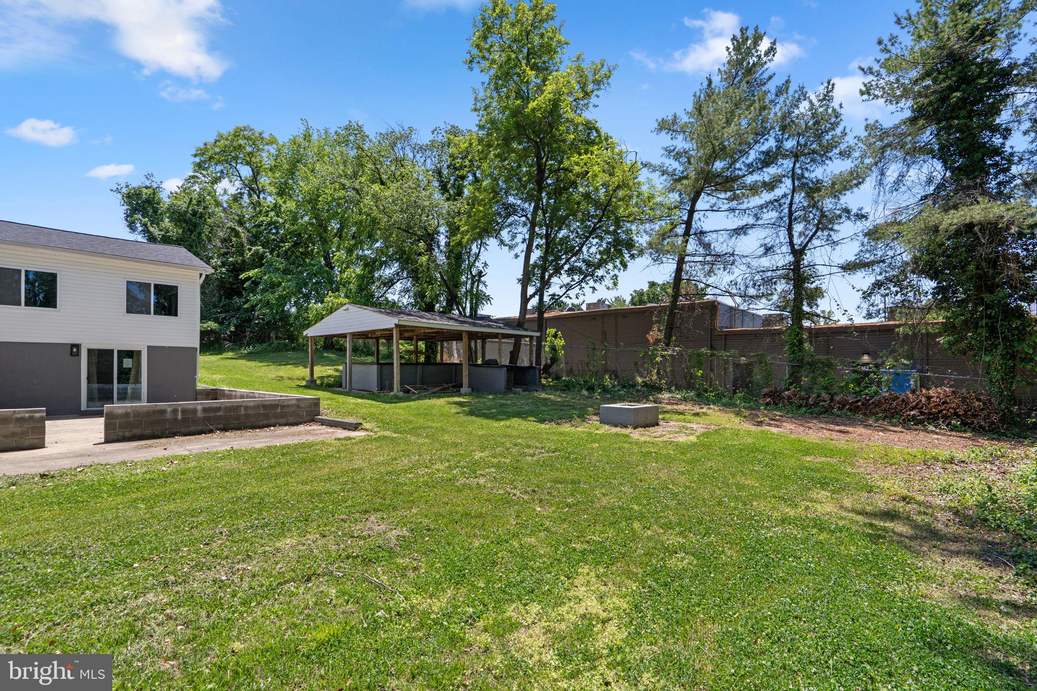 1501 Pine Grove Road Capitol Heights, MD 20743 - Photo 41 of 44 a view of a house with a yard porch and sitting area