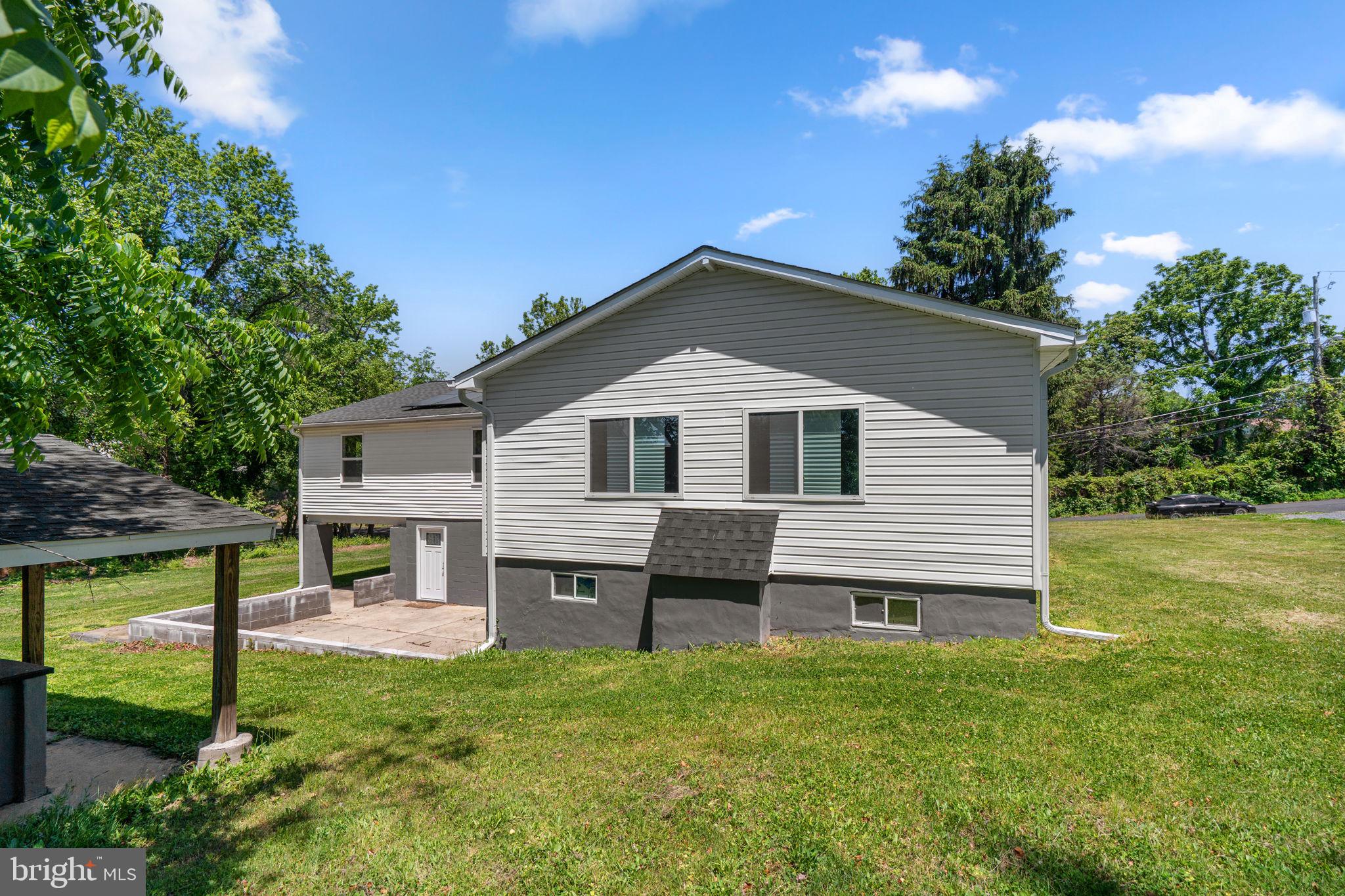 1501 Pine Grove Road Capitol Heights, MD 20743 - Photo 42 of 44 a front view of a house with a yard