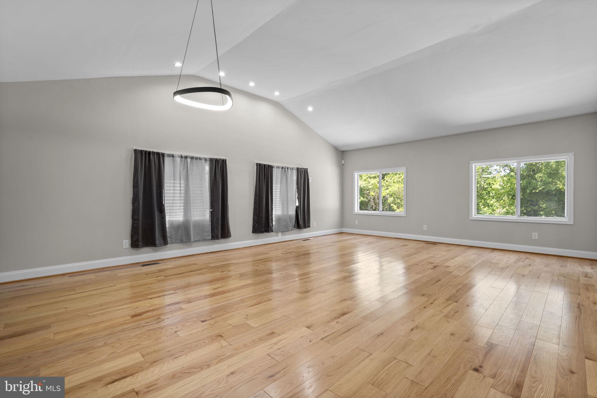 1501 Pine Grove Road Capitol Heights, MD 20743 - Photo 9 of 44 an empty room with wooden floor and windows