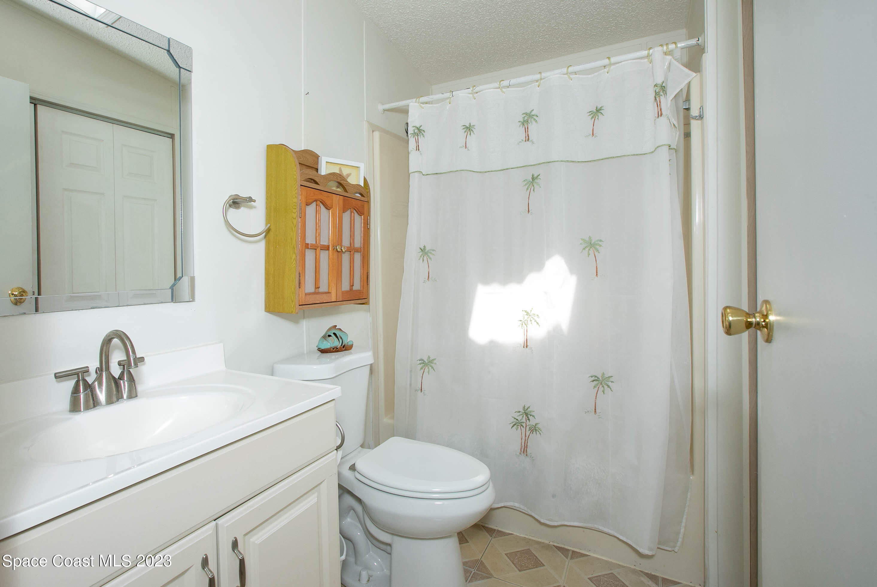 6183 97th Street Sebastian, FL 32958 - Photo 12 of 18 a bathroom with a sink toilet and shower
