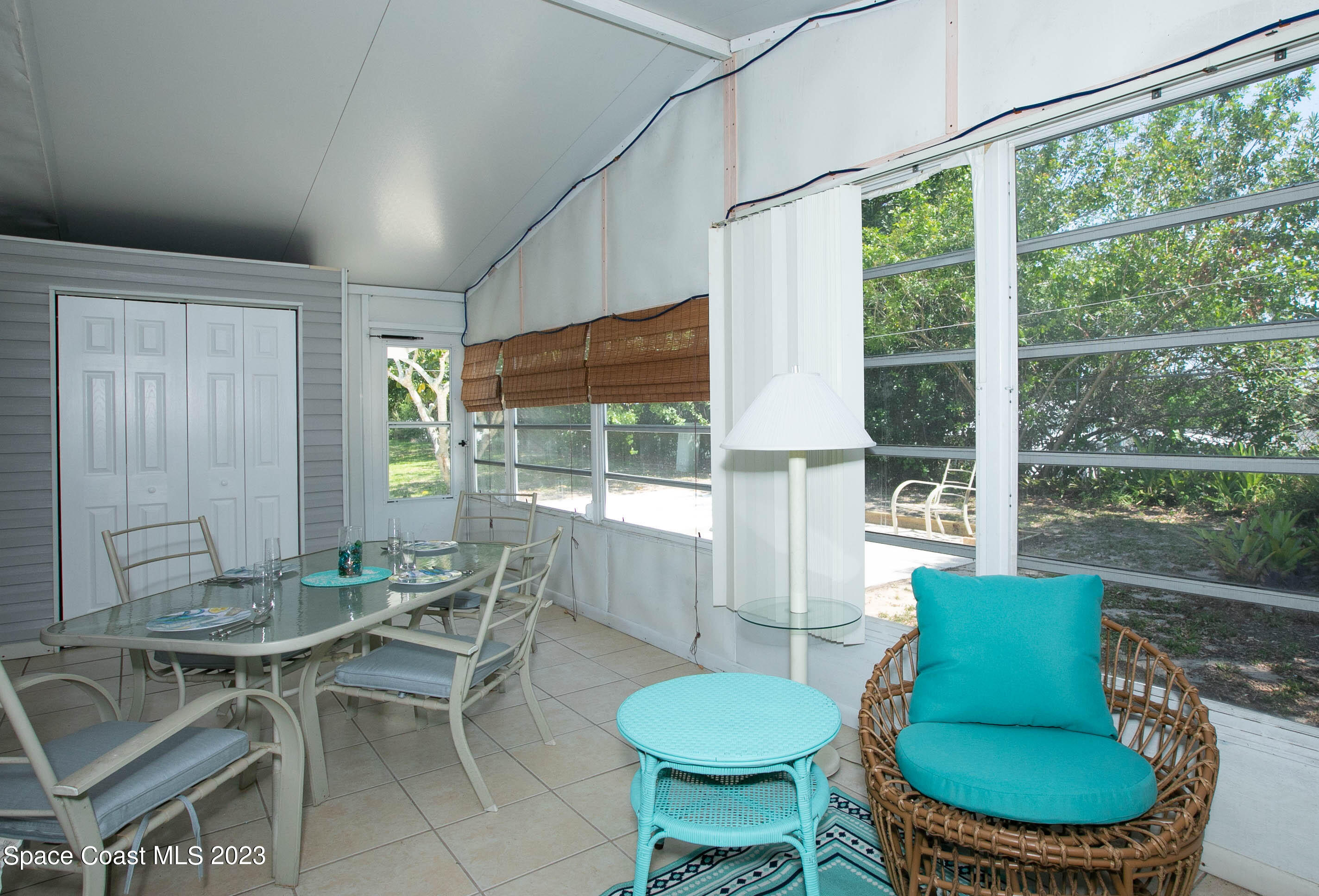 6183 97th Street Sebastian, FL 32958 - Photo 14 of 18 a outdoor dining space with furniture and outdoor view