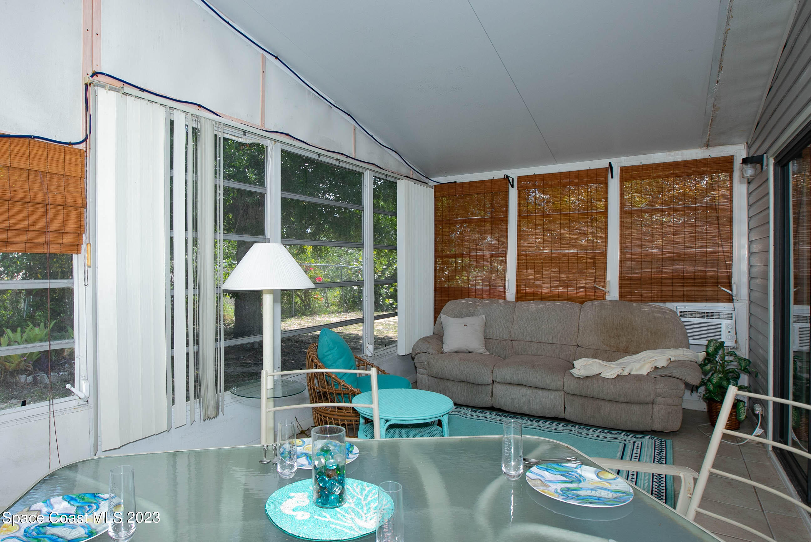 6183 97th Street Sebastian, FL 32958 - Photo 15 of 18 a living room with furniture and a large window