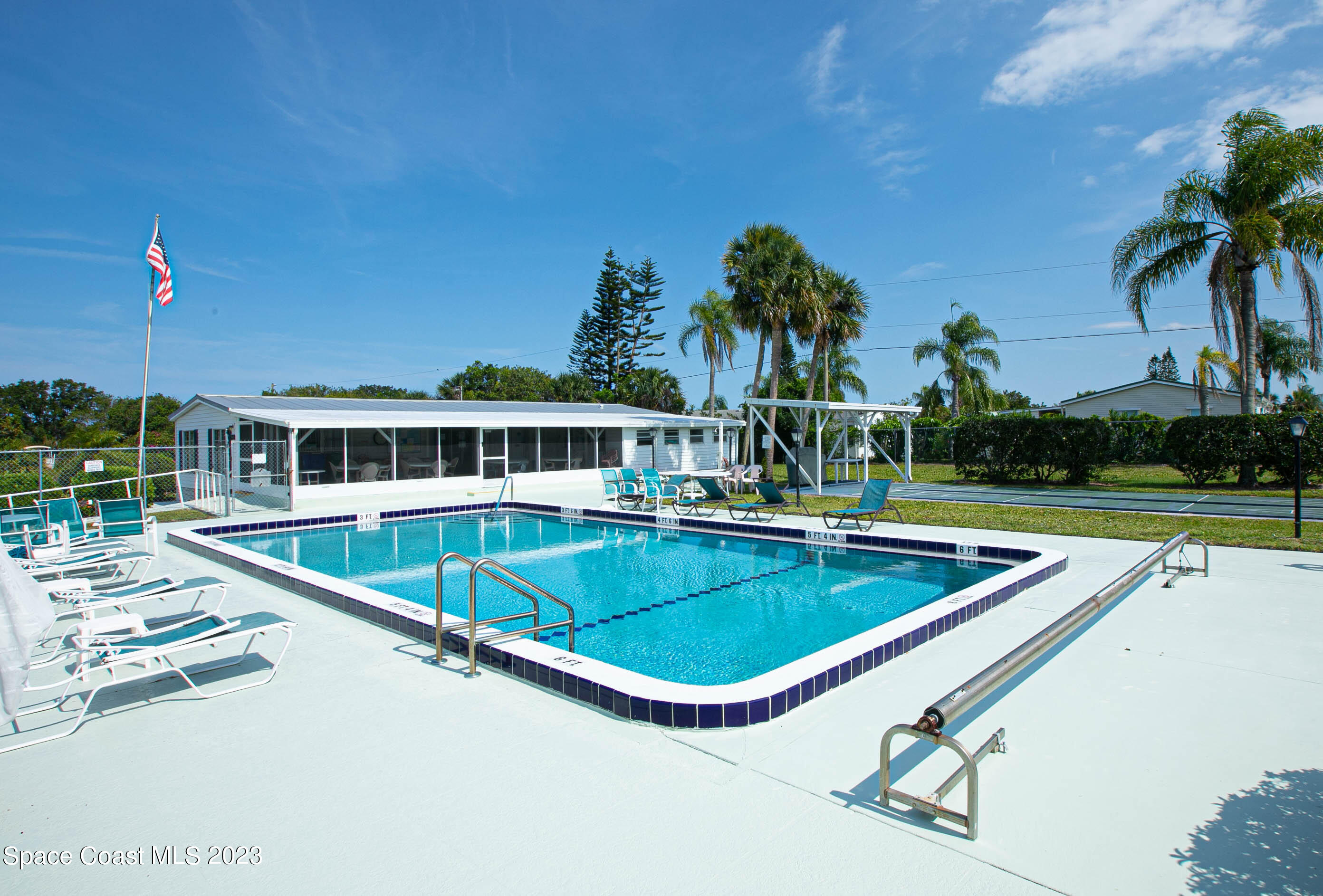 6183 97th Street Sebastian, FL 32958 - Photo 17 of 18 a view of a swimming pool with a lounge chair