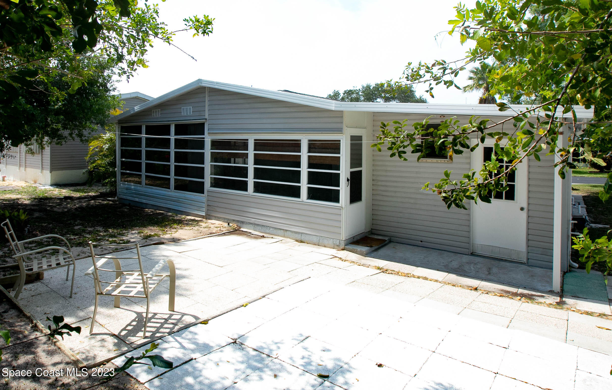 6183 97th Street Sebastian, FL 32958 - Photo 3 of 18 a house view with a backyard space
