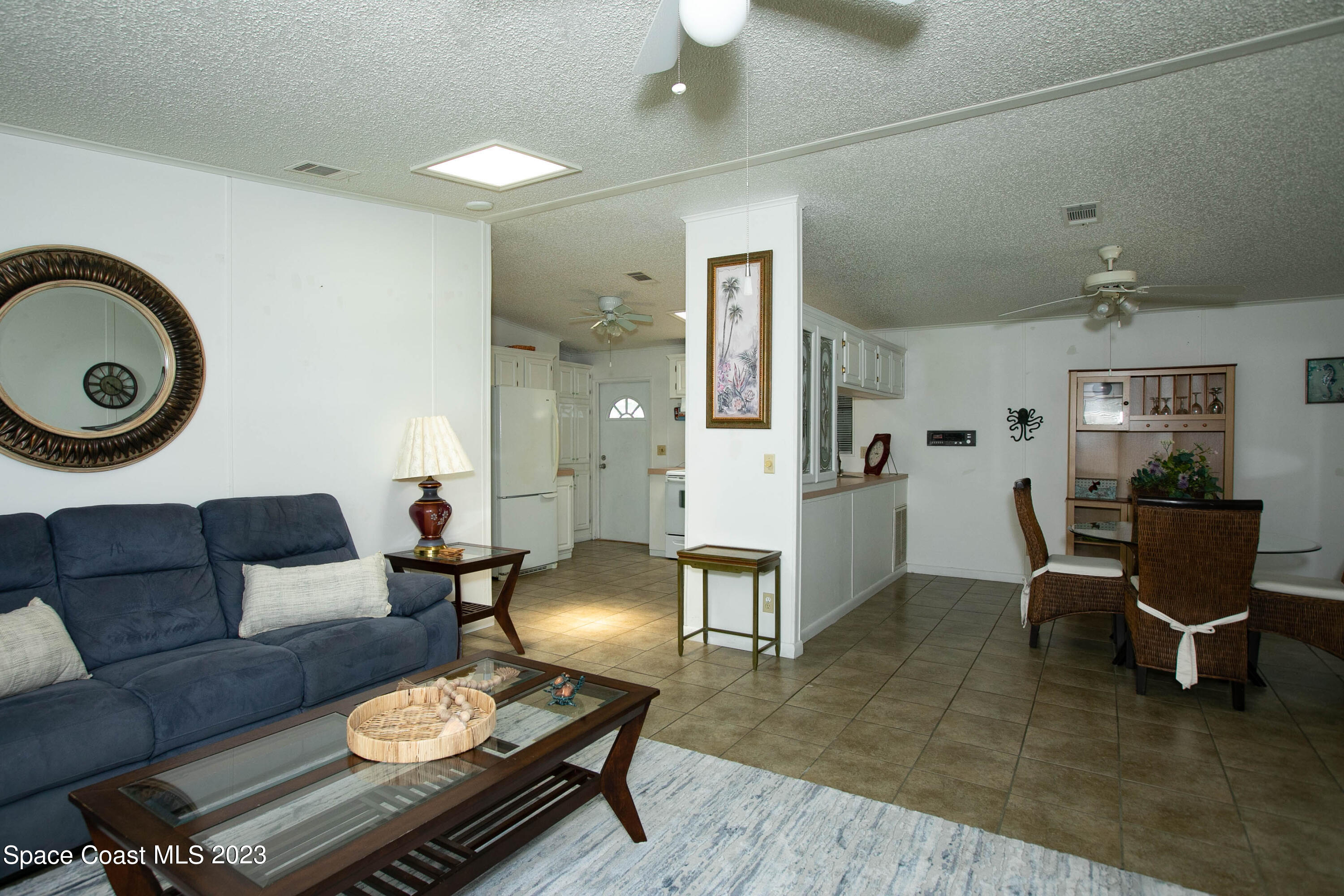 6183 97th Street Sebastian, FL 32958 - Photo 5 of 18 a living room with furniture and wooden floor