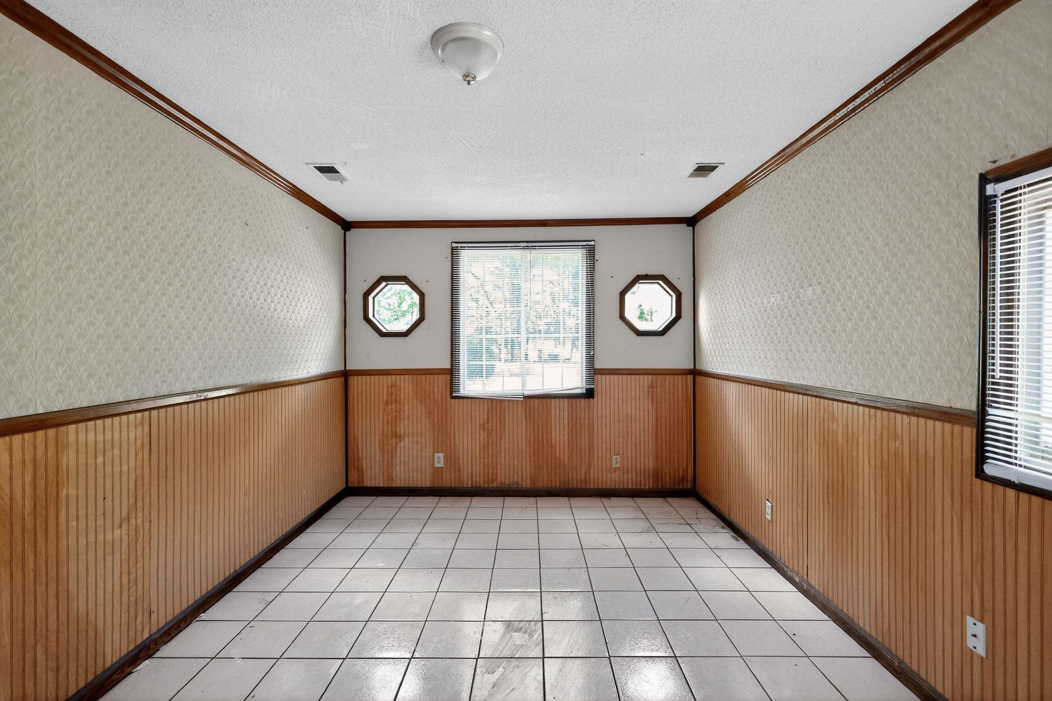 4905 Lochinvar Road Memphis, TN 38116 - Photo 11 of 33 a view of an empty room with window