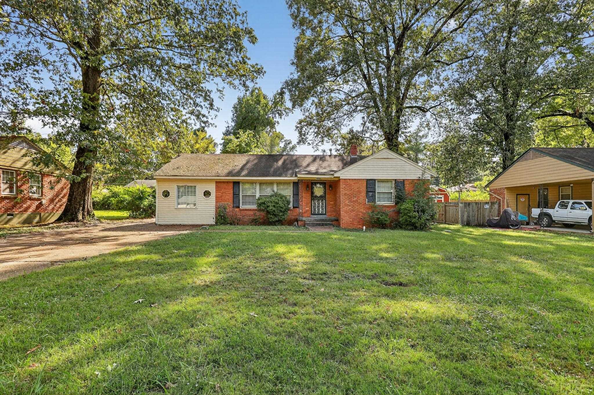 4905 Lochinvar Road Memphis, TN 38116 - Photo 26 of 33 a front view of a house with a garden