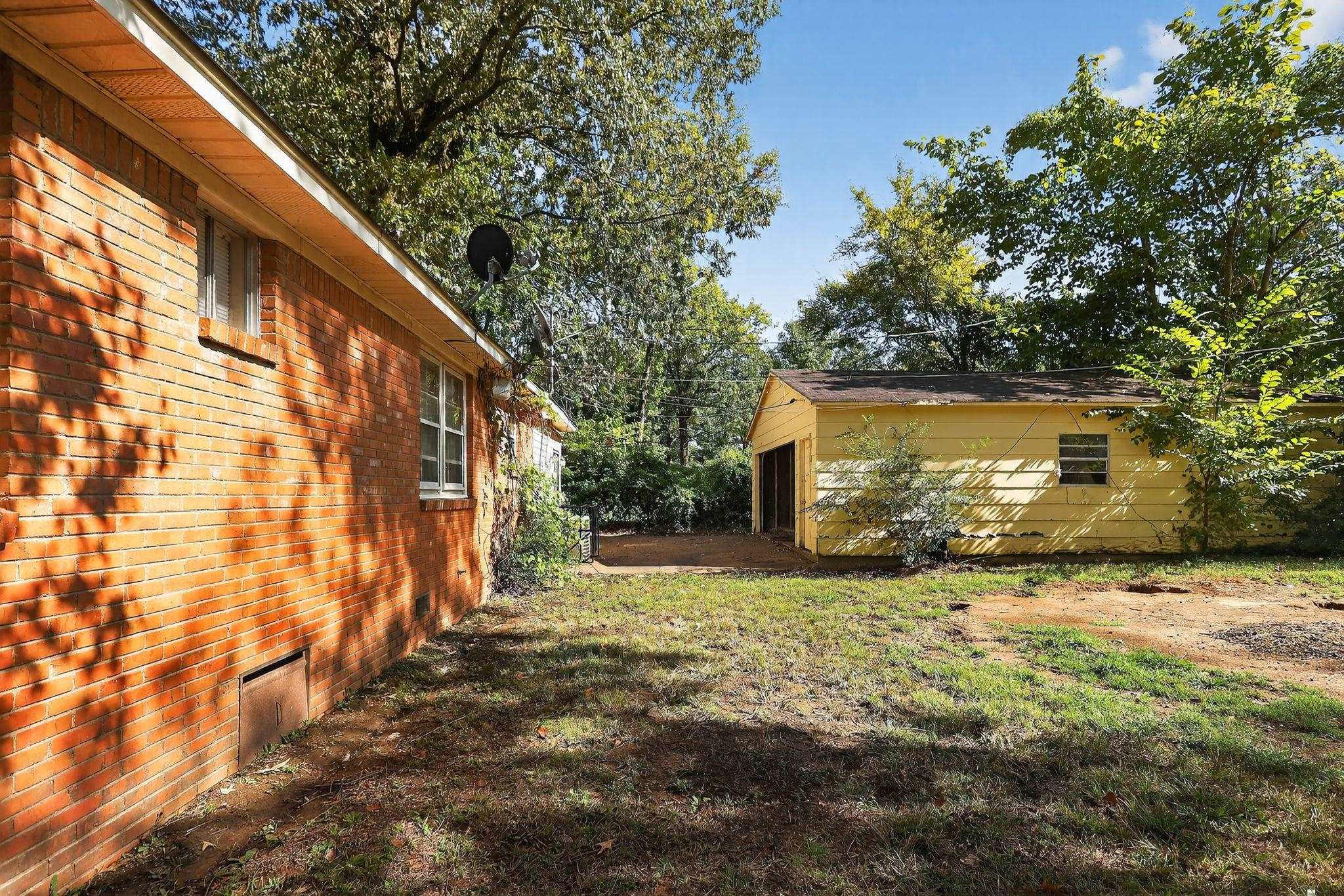 4905 Lochinvar Road Memphis, TN 38116 - Photo 31 of 33 a view of a back yard of the house