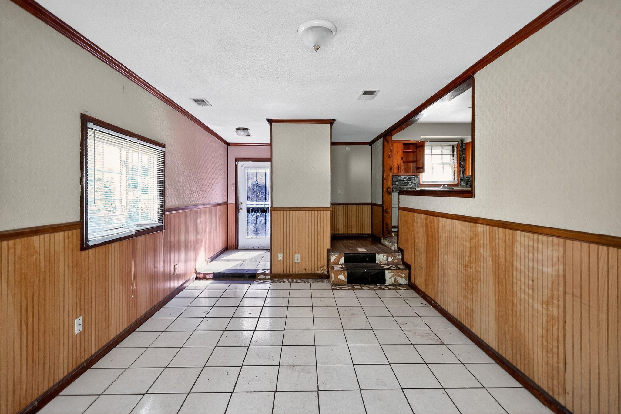 4905 Lochinvar Road Memphis, TN 38116 - Photo 8 of 33 a view of a livingroom with wooden floor and furniture
