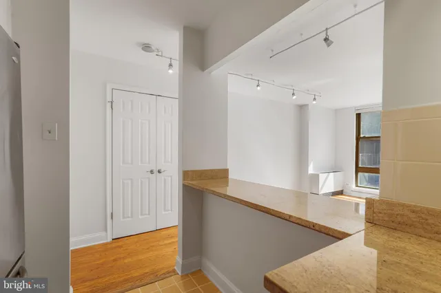a view of a kitchen cabinets and wooden floor