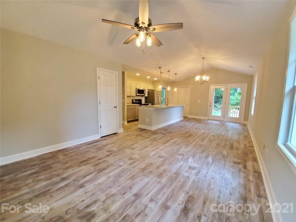 430 Porter Road Rock Hill, SC 29730 - Photo 3 of 13 a view of a big room with wooden floor and a kitchen