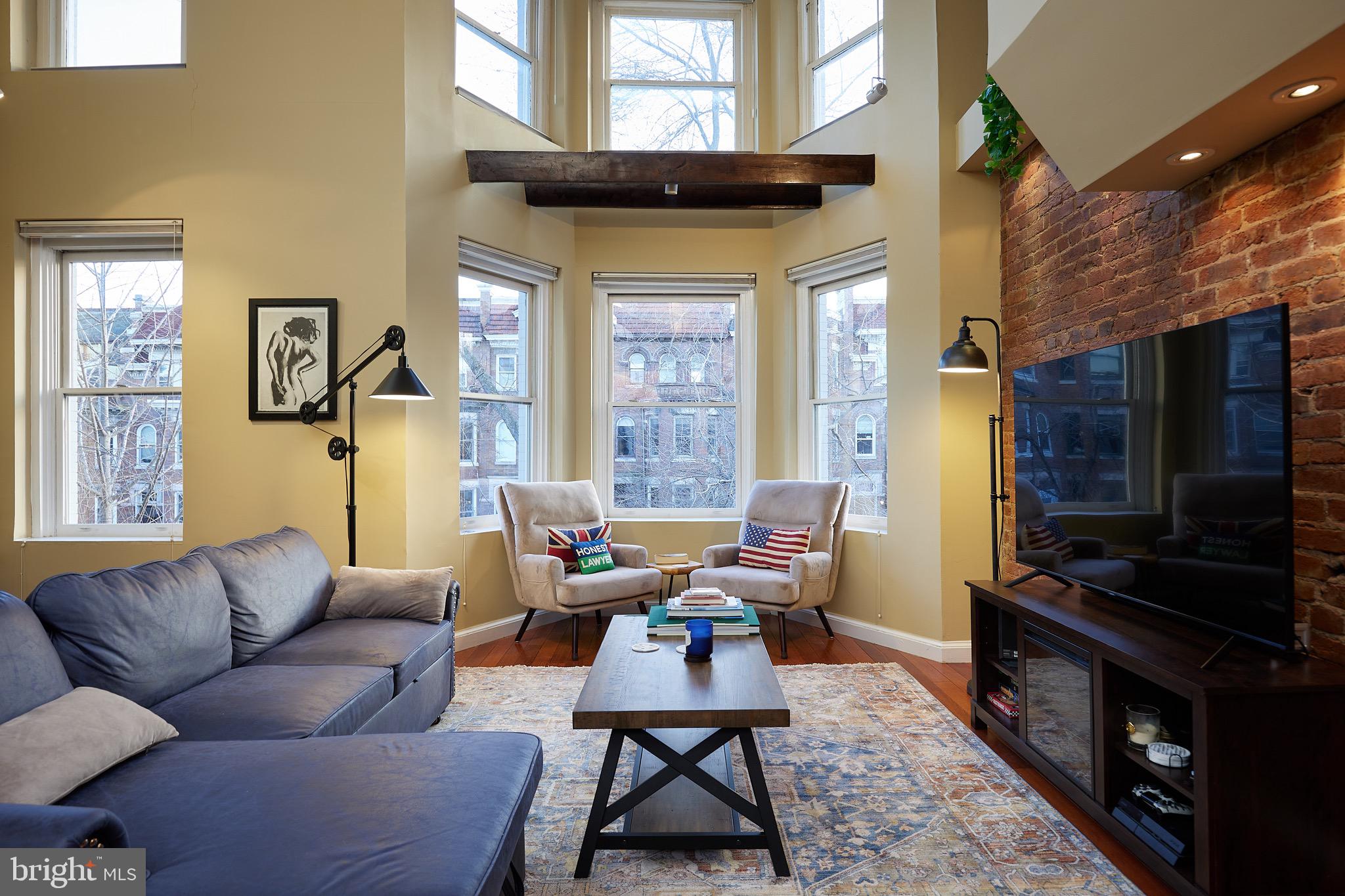1745 T Street Northwest Washington, DC 20009 - Photo 15 of 35 a living room with furniture a rug and a window