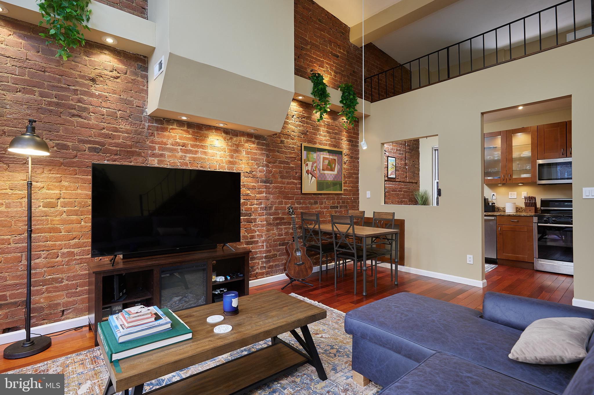 1745 T Street Northwest Washington, DC 20009 - Photo 17 of 35 a living room with furniture and a flat screen tv