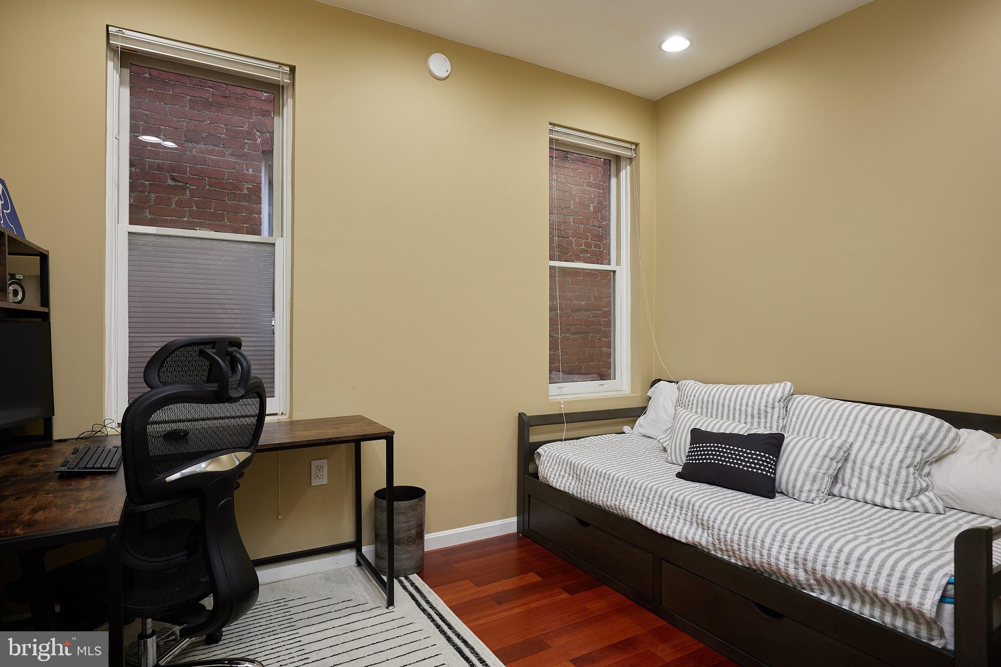 1745 T Street Northwest Washington, DC 20009 - Photo 24 of 35 a bedroom with a bed and wooden floor