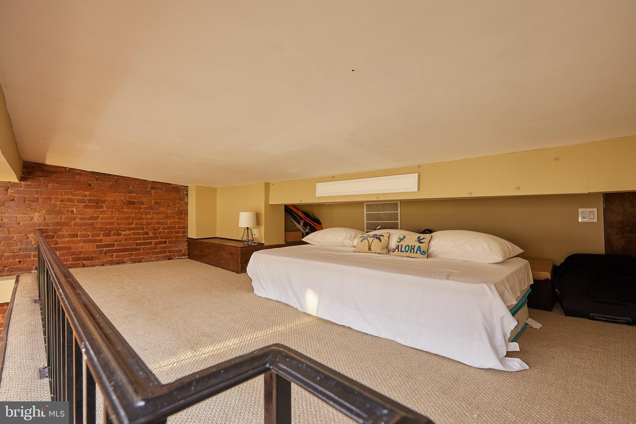 1745 T Street Northwest Washington, DC 20009 - Photo 25 of 35 a bedroom with a bed and wooden floor
