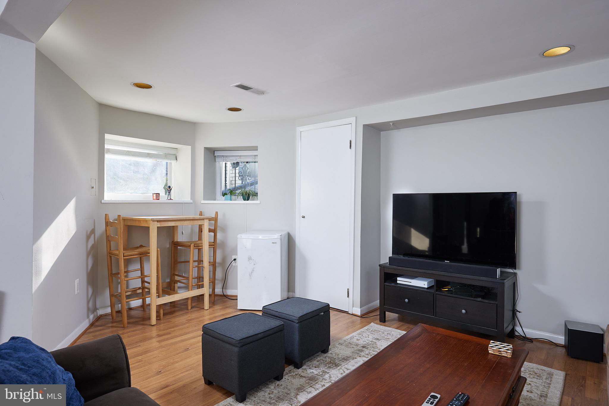 1745 T Street Northwest Washington, DC 20009 - Photo 27 of 35 a living room with furniture and a flat screen tv