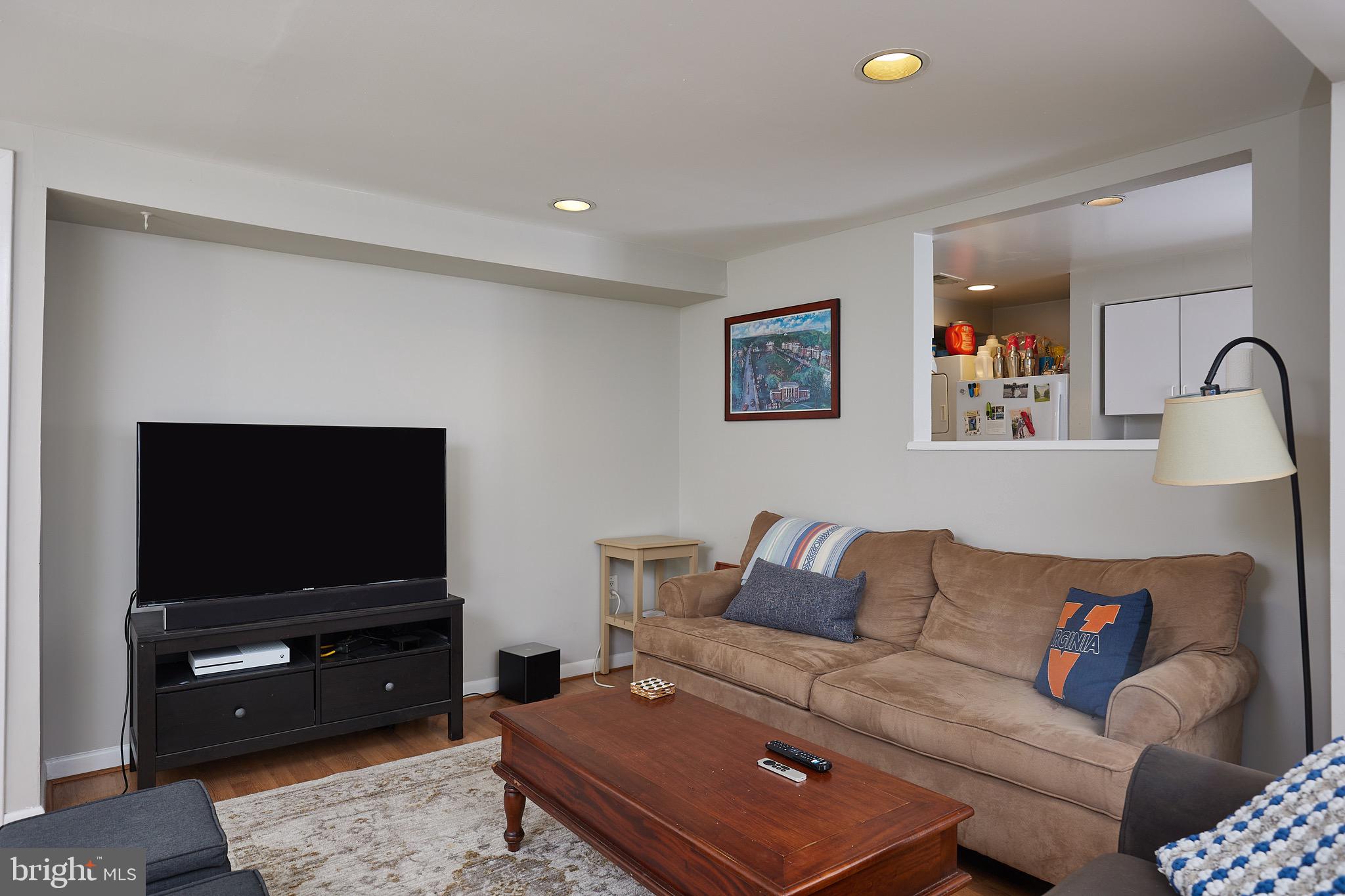 1745 T Street Northwest Washington, DC 20009 - Photo 29 of 35 a living room with furniture and a flat screen tv